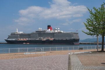 Classic ocean liner cruiseship cruise ship Elizabeth in port of Aomori, Japan with skyscraper...
