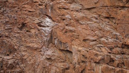 Lines and textures in rocks of mountain cliff
