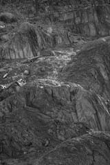 Lines and textures in rocks of mountain cliff