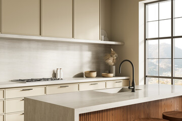 Modern minimalist kitchen interior with beige cabinets, large window, and neutral tones creating a serene natural atmosphere bathed in daylight. 3D Rendering