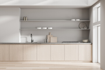 Minimalist Scandinavian kitchen interior with light wood cabinets, concrete countertop, open shelving, and soft natural daylight illumination. 3D Rendering