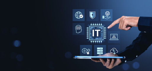 IT technology icons with hand interacting on digital tablet over dark blue background.