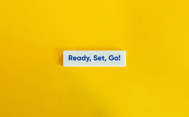 Ready Set Go Phrase on Letter Tile on Yellow Background – Minimal Motivational Concept