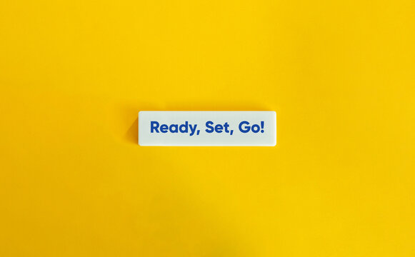 Ready Set Go Phrase on Letter Tile on Yellow Background – Minimal Motivational Concept