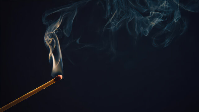 Matchstick burning and producing smoke in dark setting - Powered by Adobe