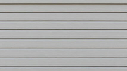 Obraz premium Close up of a neutral hued exterior siding demonstrating a consistent pattern and clean aesthetic appeal