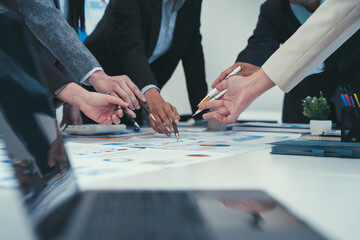 Business Team Collaboration on Financial Charts