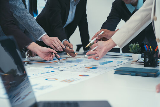 Collaborative Business Team Analyzing Data - Powered by Adobe