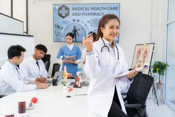 Smiling Doctor Leading Medical Team Meeting