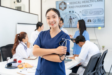 Obraz premium Confident Asian Female Doctor with Medical Team