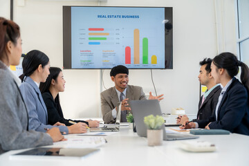 Business Presentation with Diverse Team in Meeting Room