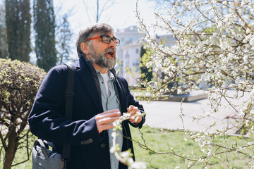 Senior man suffering from pollen allergy in spring