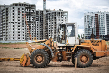 Construction site with heavy machinery working on new building developments in urban area
