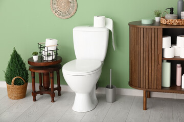 Stylish interior of modern restroom with potted plant