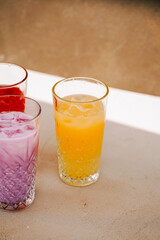 Colorful drinks on a table during a warm afternoon gathering