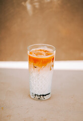 Refreshing drink with layers of color served in a clear glass