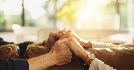 Holding hands, sofa and couple in home for love, affection and connection for relationship. Marriage, communication and man with woman together for bonding, support and commitment in living room