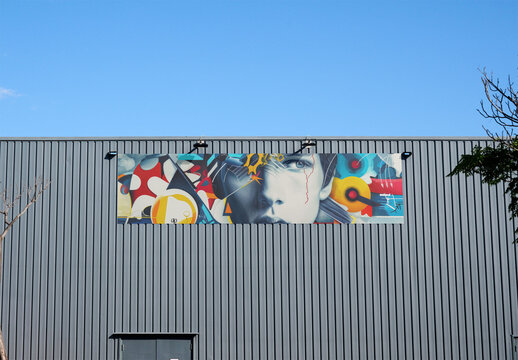 Horizontal Billboard retail business Mockup Displayed on wharehouse Facade