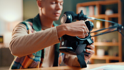 Home, influencer and man with review, VR glasses and content creation with information. Apartment,...