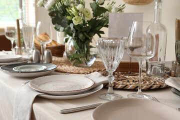 Beautiful table setting with eustoma flowers for wedding celebration in room, closeup
