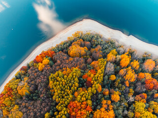 Liptov region with Tatras mountains around. Liptovska mara dam landspace. autumn deciduous forest...