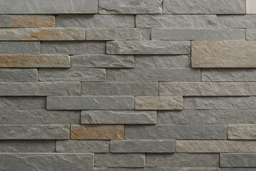 Obraz premium Elegant Stone Facade: A meticulously crafted stone facade displays a harmonious blend of textures and tones, perfect for adding timeless charm and sophistication to any architectural design.