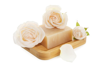 Aromatic soap bar and roses isolated on white