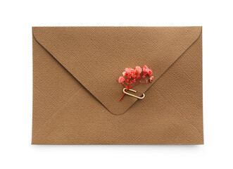 Beautiful invitation envelope with flower isolated on white, top view