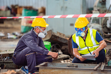 Man inspector scientist investigate chemical gas leak spill with safety face mask PPE suit in area...