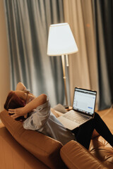 Woman suffers from tech neck and digital eye strain while working from home on laptop reflecting modern health issues caused by prolonged screen exposure and poor digital ergonomics