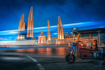 Thailand famous attraction Democracy Monument Bangkok and iconic landmark Tuk Tuk near tourist...