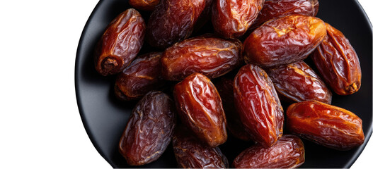 Dried dates piled in a black bowl