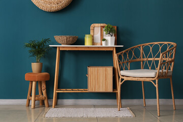 Interior of living room with table, armchair and stool