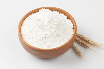 Flour is a powder made by grinding wheat.

