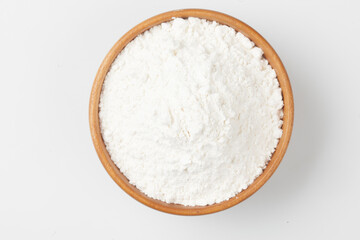 Flour is a powder made by grinding wheat.
