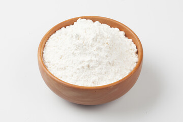 Flour is a powder made by grinding wheat.
