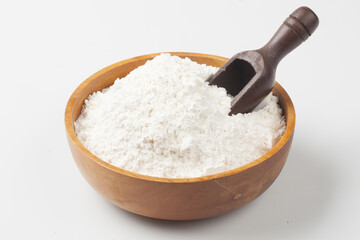 Flour is a powder made by grinding wheat.
