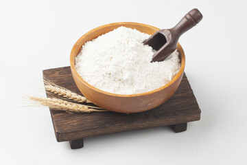 Flour is a powder made by grinding wheat.
