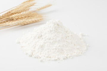 Flour is a powder made by grinding wheat.
