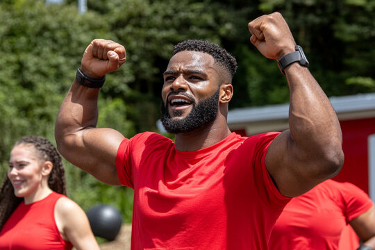 Fitness bootcamp participants enjoy outdoor training session together