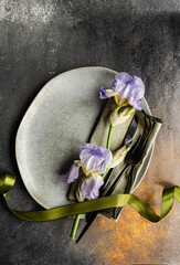 Table setting with pale blue iris flowers