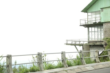 Obraz premium Safety railing along road and old building. Space for text