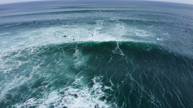 4K video of Huge Atlantic ocean waves with surfer during international surfers challenge at Praia do Norte in Nazare, Farol da Nazar&eacute;, Portugal where Guinness World Record for highest surfing was set