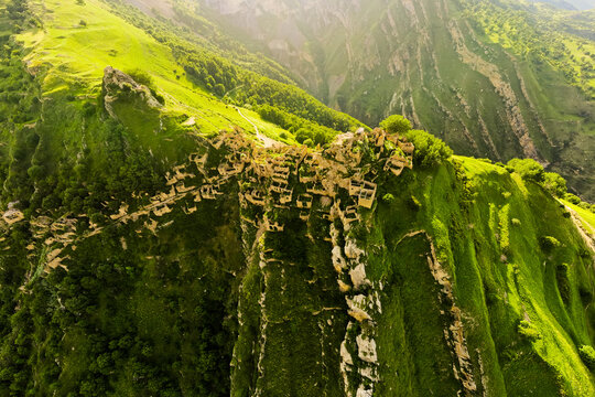 Old stone houses in abandoned Gamsutl mountain village in Dagestan, Russia. Aerial panoramic view.