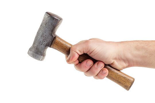 Closeup of a strong hand gripping a rusty hammer with a wooden handle against a a detailed image of a vintage tool diy man old work grey used iron metal on transparent background