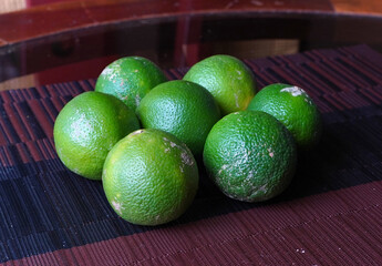 Green lemons on a table, fresh fruit, Costa Rica