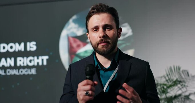 Businessman, presentation or seminar with mic for freedom speech, human rights or peace. Man, speaker or spokesperson talking for free palestine, cease fire or fight for global equality or humanity
