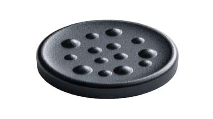 Abstract black circular design element with textured surface and multiple small raised dots detailed close up studio shot high resolution image perfect on transparent background