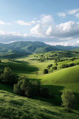 Obraz premium Serene green hills and lush valleys under blue sky with white clouds
