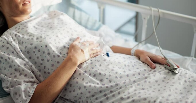 Pain, healthcare and woman in hospital bed, IV drip and medical emergency with recovery. Resting, person and patient in clinic, healing and illness with disease, morphine and cancer diagnosis